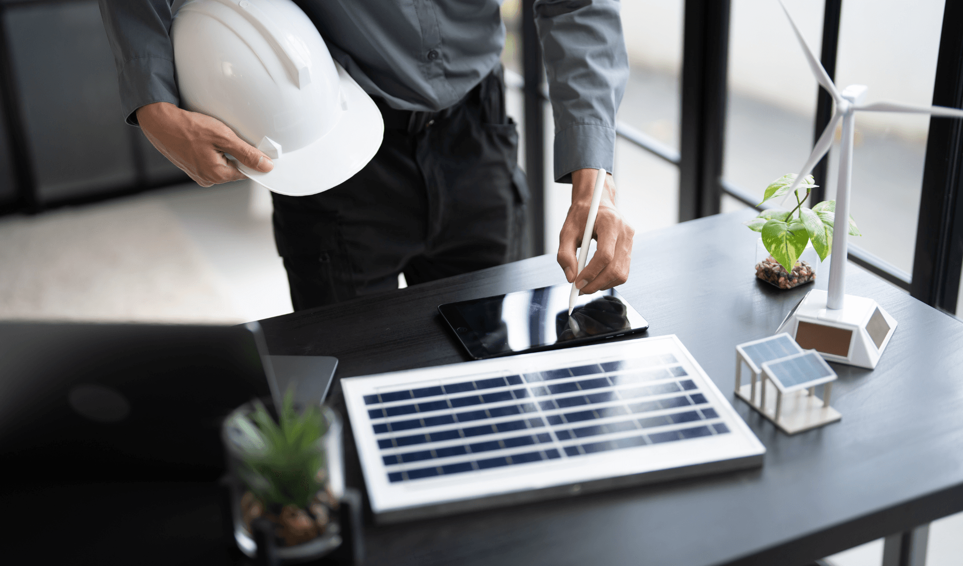 Solar engineers installing rooftop solar panels on residential property in UK